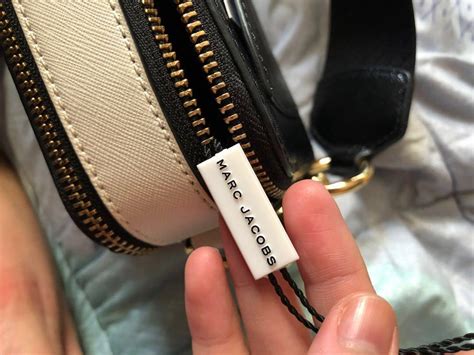 how to spot fake marc jacobs bag|marc jacobs tote bag dhgate.